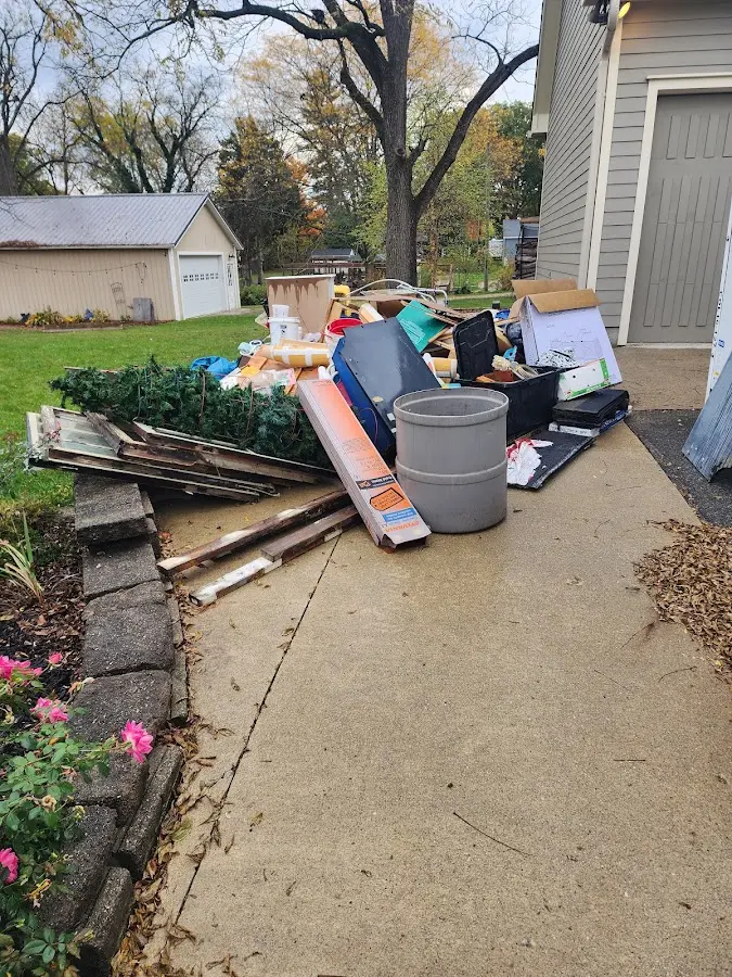 Dumpster being loaded with debris for 30 Yard Dumpster Rental in North Haven